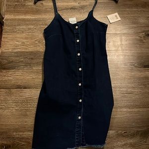 I am selling a denim dress. The size of the dress is medium. Brand new